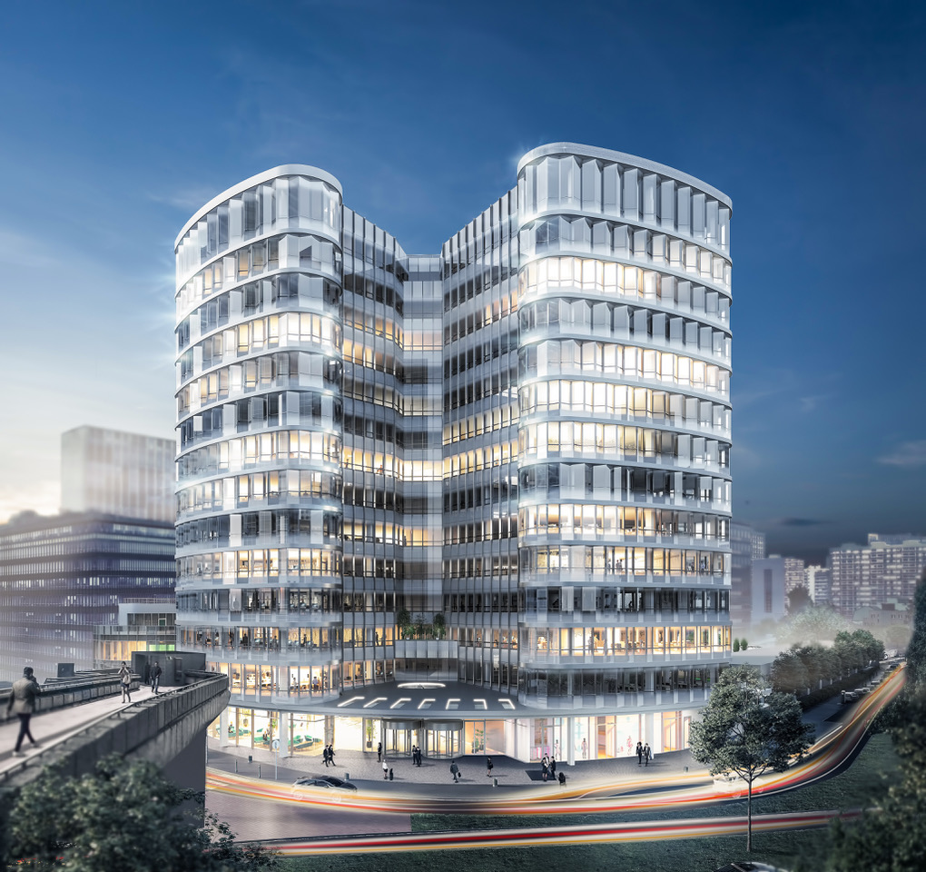 Cette image montre le bâtiment du campus Cyber : il s'agit d'une tour éclairée la nuit.